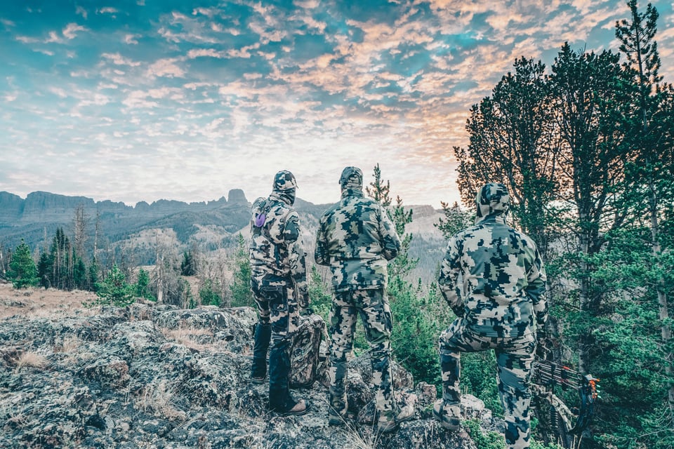 Three Archery Hunters on a Mountain